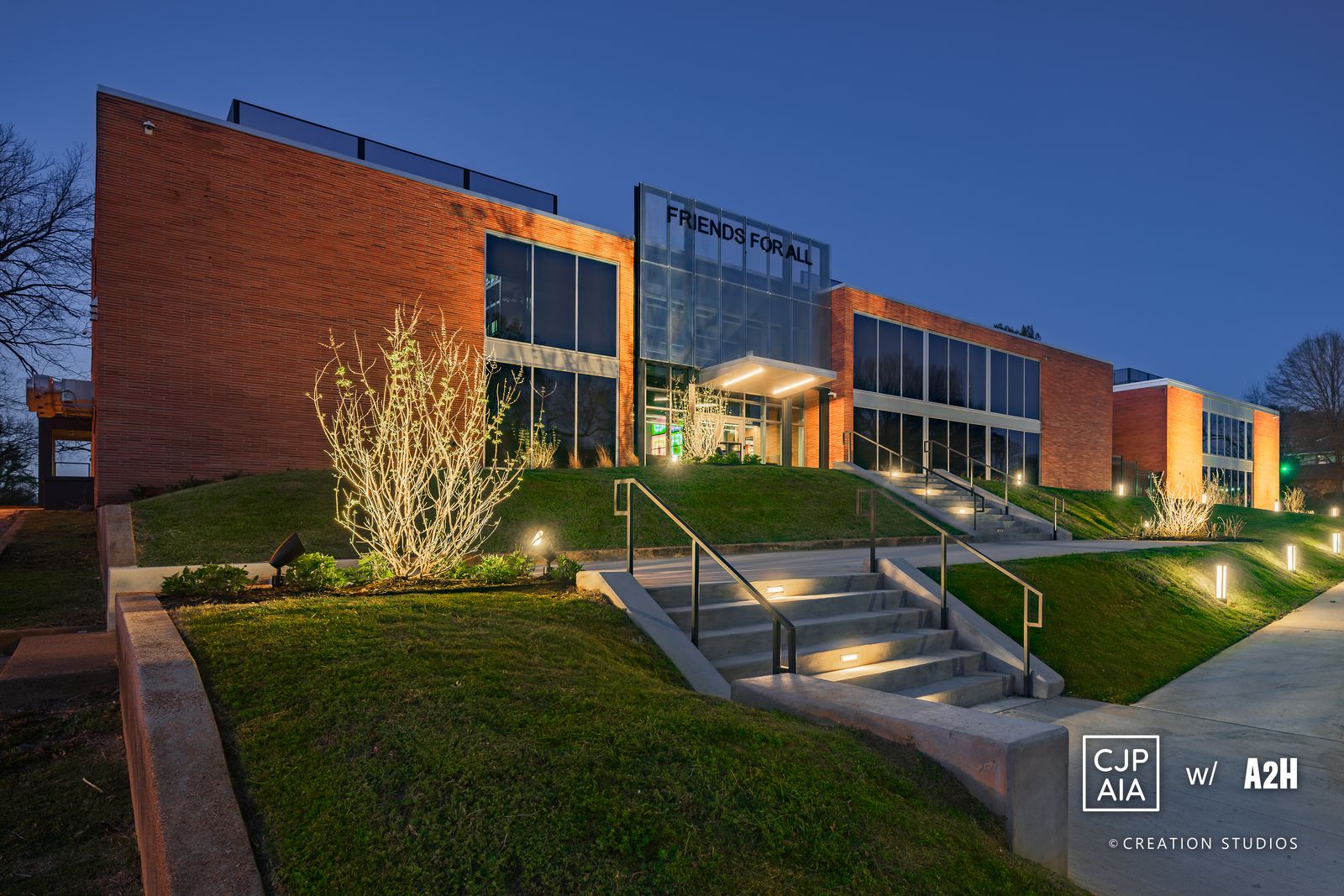 Friends For All headquarters at dusk, 1548 Poplar Avenue, Memphis.
